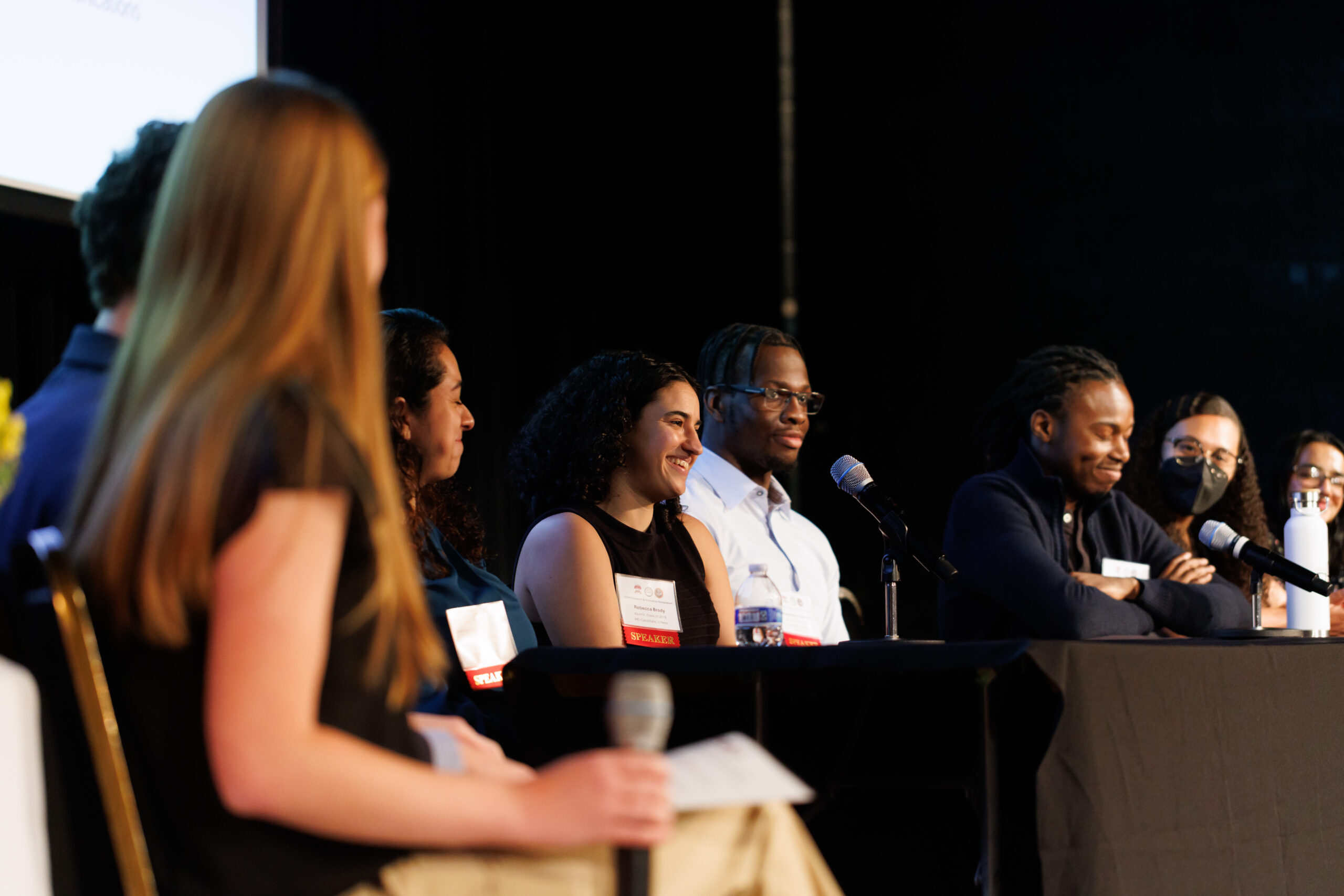 Students looking at Alum Panel